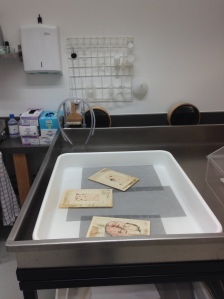 Washing prints to reduce staining. Photograph by Amy Walsh.